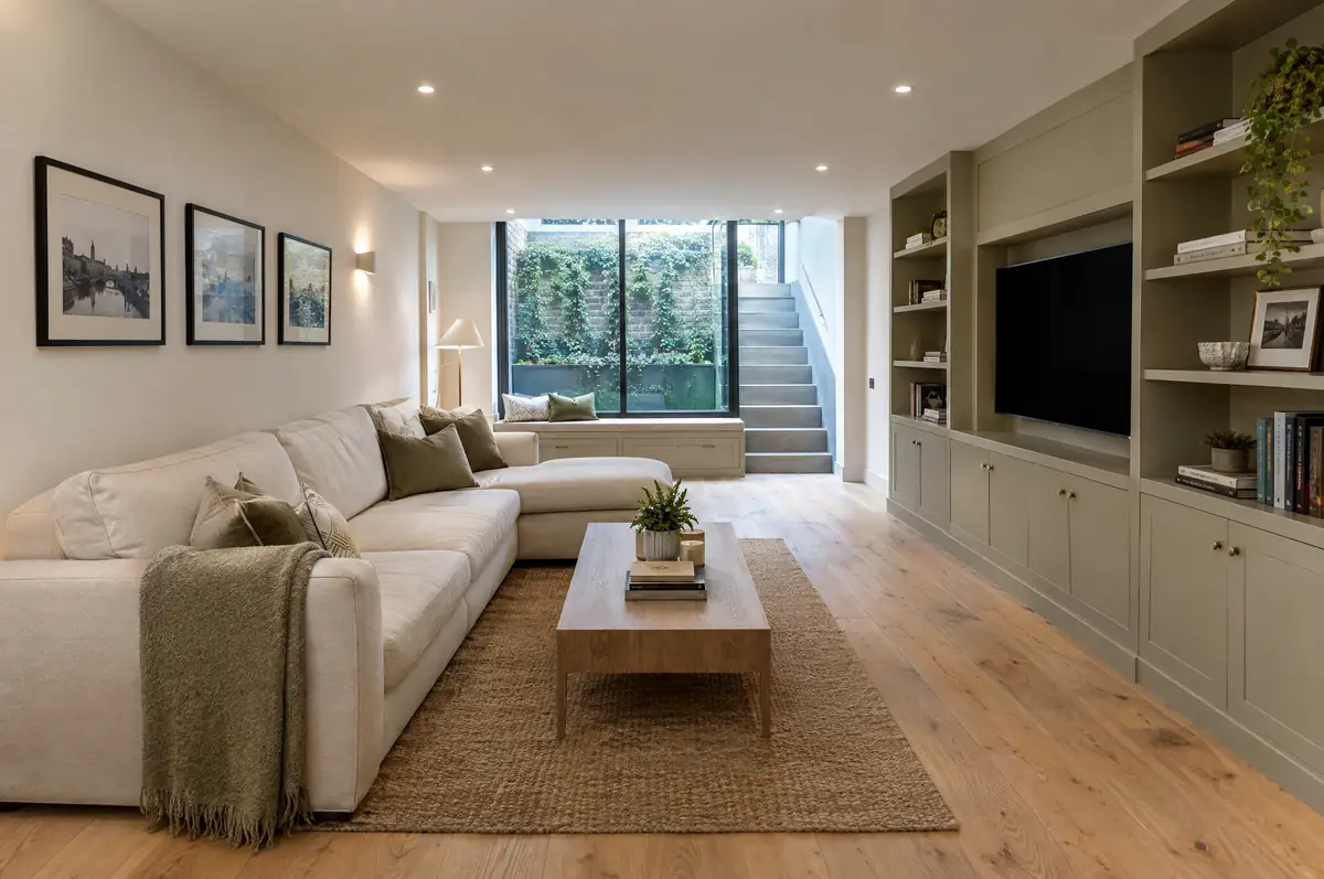 Converted basement family room with lightwell glazing and built-in joinery