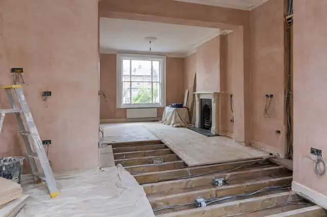 Victorian house interior mid-renovation with fresh plaster and new electrics