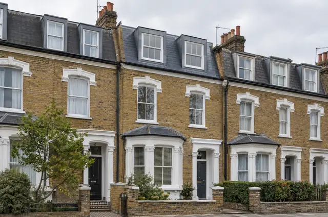 London Victorian terrace with a slate mansard roof and lead-clad dormer windows