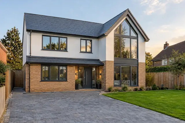 Newly completed contemporary detached house in brick and render with a glazed gable